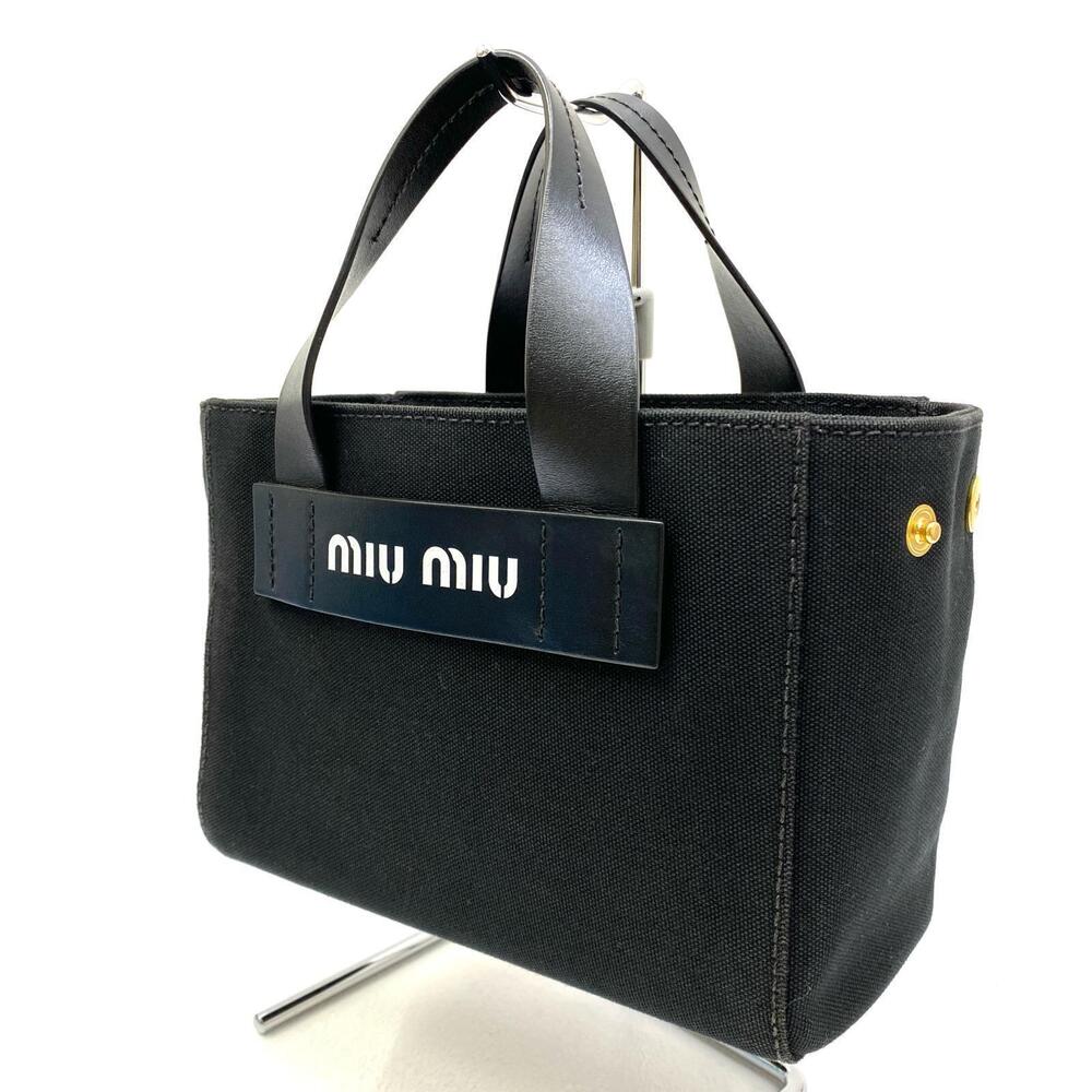 Miu Miu black canvas tote rolled leather handles raised logo